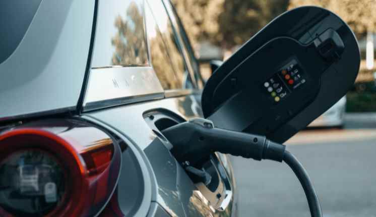A car charging at a gas station