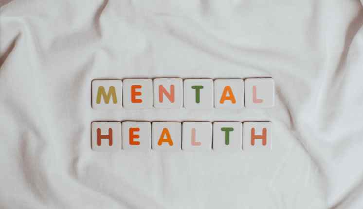 Letters on a fabric, reading out the words "MENTAL HEALTH"