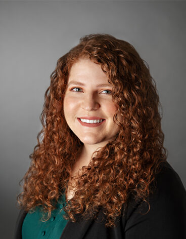 A person with curly red hair