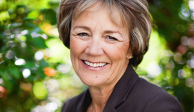 A close-up of a person smiling