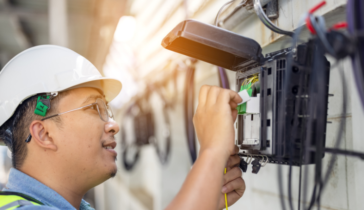 man plugging in wires