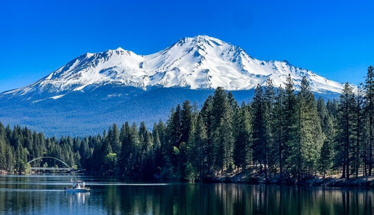 A lake with a mountain in the background