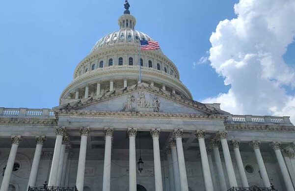 An upward-angle view of the capitol building in Washington D.C.