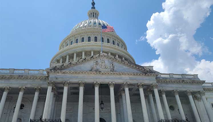 An upward-angle view of the capitol building in Washington D.C.