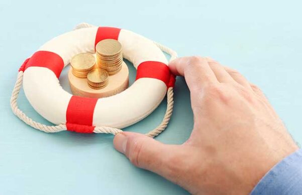 hand grasping a bouy on blue background with coins floating in the middle