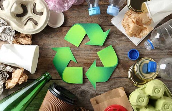 recycling symbol surrounded by trash