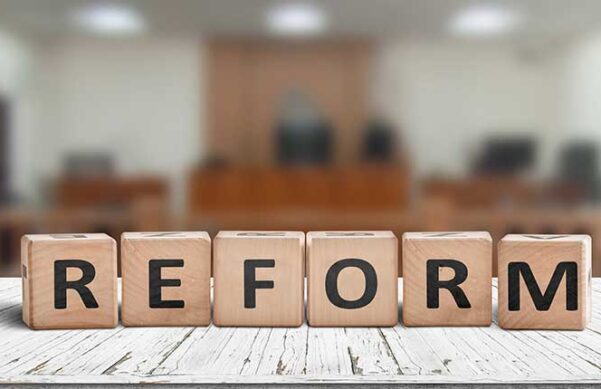 wooden blocks with letters on them set in front of a blurred background