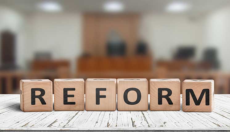 wooden blocks with letters on them set in front of a blurred background