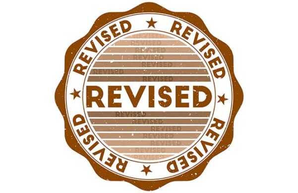 circular stamp with scalloped edges that says Revised