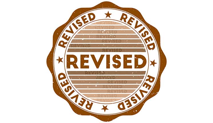 circular stamp with scalloped edges that says Revised
