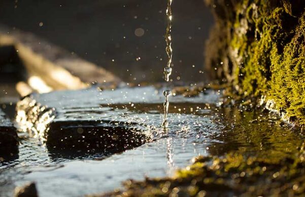 trickle of water into a stream