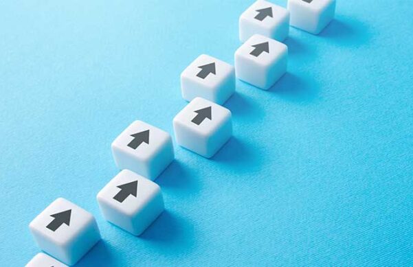 blue background against white dice with black arrows