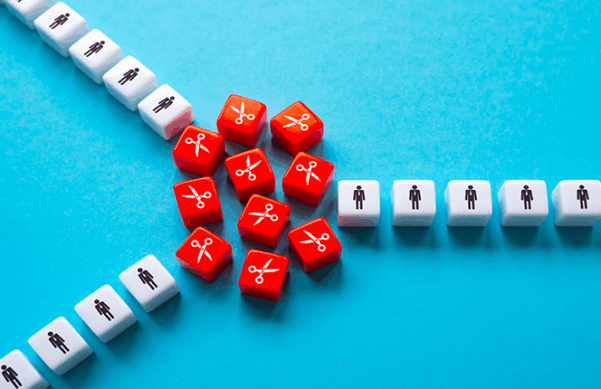 red cubes with white scissors on them, grouped between three lines of white cubes with human shapes on them, against blue background